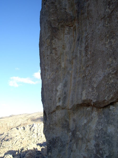 Not the best photo, but the route follows the face right of the arete. There is a leaver 'biner visible on the fourth bolt in the photo. 