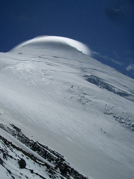 A lenticular cloud formed briefly during our Jan 2007 ascent, but thankfully dissipated a few minutes later. We had little wind and clear skies during our ascent, although the last 100m or so up the summit slopes was ~45degrees and icy.