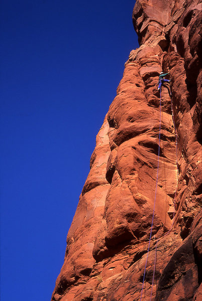 Tomas stemming between the two-level towers on the first pitch, above the tips crack crux. 