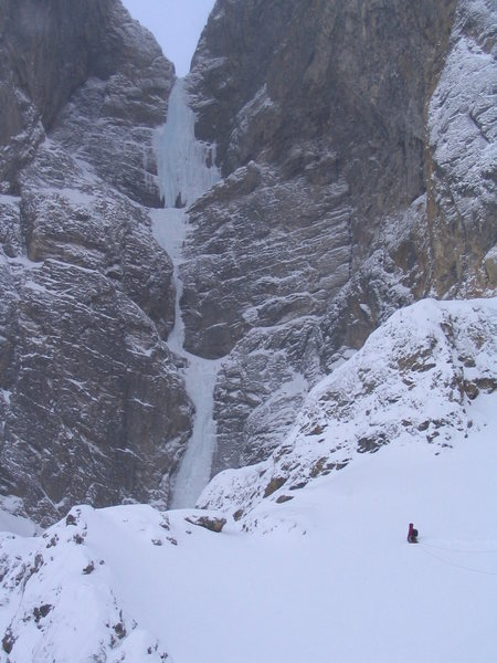 Traversing the snow basin to the base of the upper tiers, each climbed in two pitches.