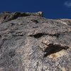 Looking up at the second pitch from the first belay; the first bolt is marked with a red 'X'.