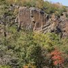 Shot from the access road. Tarp used to mark top of route for anchor placement. Tarp was roughly 5'x 5' to give you an idea of face height. One 60m rope toproped was perfect length wise.