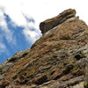 Looking up the southeast face from the top of the first pitch. The route crosses the arete to the north face on the right of the photo.