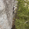 Unknown climber starting the crux of Cortical Supression.