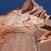 Raven follows the wandering crack system on the right side of the tower. the crux of the route is the visible flake at the top of the photo.