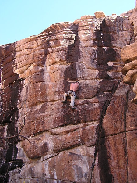 Dave M. on the juggy Black Ape. Climbing in the shade with no shirt in November, gotta love Colorado.