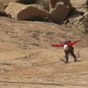 Paul doing strange rope manipulations on the hanging belay of P2 !. Photo Lance Bateman