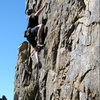 Erik on the first crux of "Candy-O".<br>
Photo by Blitzo.