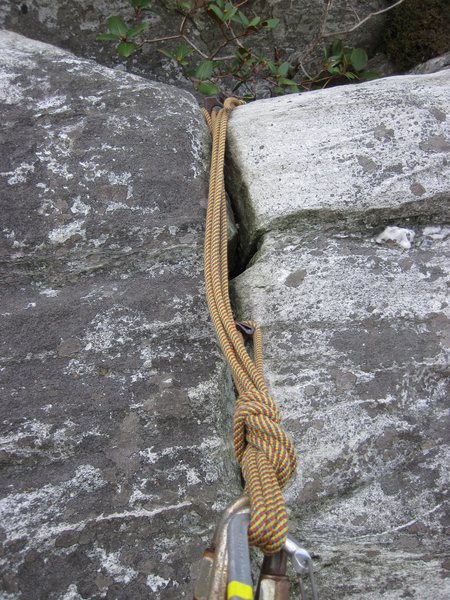 Fixed anchors at the top of the North Ridge's first pitch, as of November 2010.  The pins look good and the cordlette looks new.  Thanks to whoever placed this.