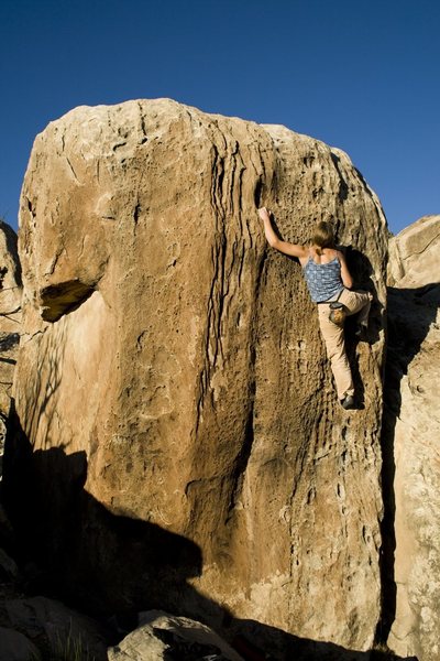 cassie doing the moves. probably on of the most beautiful V1s to do and photo in the country. climb it late in the day and get outstanding colors and shadows of the pocketed face. 