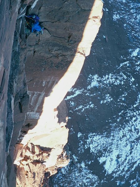 Out of the sun on a cold day. On the ledge after the crux pitch