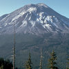 Mount St. Helens the day before the 1980 eruption, which removed much of the northern face of the mountain, leaving a large crater.<br>
Wikipedia photo.