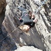 Anna crimping through the crux on her first 5.11 lead. 