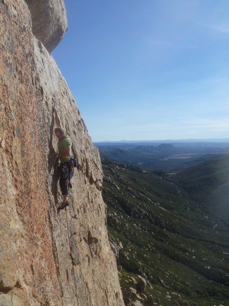 approaching the crux on Wish You Were Here 5.10a