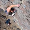 James digs his fingers in at the top of the layback crux moves. December 2010.