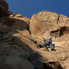 Above the first ledge, midway up.