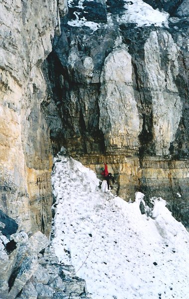 Around a buttress to the top of the upper snowfield is this wet gully/chimney.  Mike is establishing a belay before the wet chimney pitch.