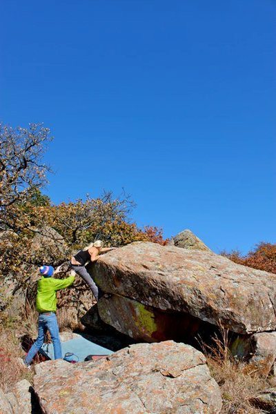 Working out the topout on the first ascent of Monstradomus....