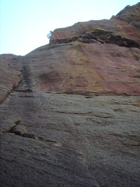 Bazooka follows the thin seam from the ledge up through the red rock.