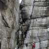 Max making the traverse after pulling a KB while hanging from a hooked leeper.