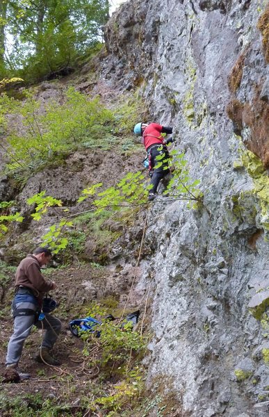 This should help folks suss out the location for the start of the route although it's easy to find. Basically just walk straight uphill from the reading room cave and start climbing up where you see a single belay bolt. Belaying from under the overhang @ 10' right of the route is recommended until all of the loose stuff is off. <br>
<br>
*Note* someone gave it 3 stars? Huh? I think the last pitch of this route could conceivably be called 3 stars. Frikkan sweet pitch no doubt! Great body movements, varied and interesting climbing with some crazy chimney moves, stems and nice rests in addition to being fairly solid. Perfect location as well, man, it's up there in space and it's a great view...but...uhhh....that first pitch....uhhh....come on!?! 3 stars? It has choss and is just butt assed ballsy for a bolted route. Put some more bolts on it and I could go 1 star, maybe 2 if you really did a nice clean up as well. <br>
<br>
Ujahn Davisson photo