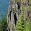 Distance shot of Ben Priestly and Scott Peterson on The Salethe Highway route on the Old Witch Pinnacle. The other, close up picture of Adam on the route is just below where Scott (white shirt, lower climber) is in this picture. Clicking on the picture will blow it up. <br>
<br>
South Side of Mount Hood can be seen peeking over the timbered ridge in the background. 