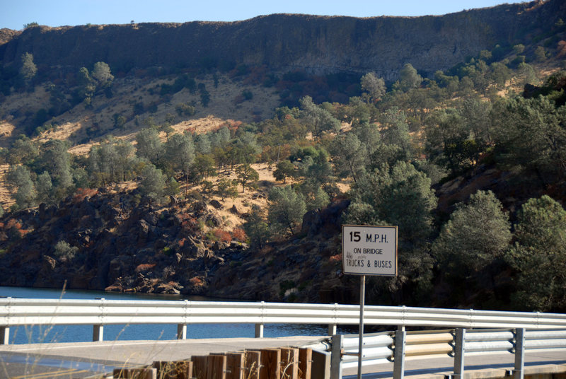 Photo of Jailhouse Rock cliffline from O'Byrnes Ferry Road bridge over Tulloch Lake