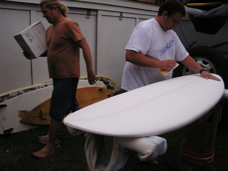 Timmy shaping his new board in the back yard.