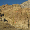 The route. The line is drawn in just to the right of the features you climb. Note the climbers on the right side (climbing Brain Full of Spiders?).