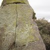 A short but pleasant (not too rough on the fingers) finger crack along the north west aspect of the fin-shaped boulder. It probably would go at ~5.7-5.8 and we be terrific if it were 10 times longer.