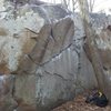 N Face of the Slice & Dice Boulder.  Two Can Sam starts in the juggy horizontal crack in the dead center of the photo and goes left up the overhanging splitter.