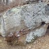 Manute Bol climbs up the left side of this boulder.