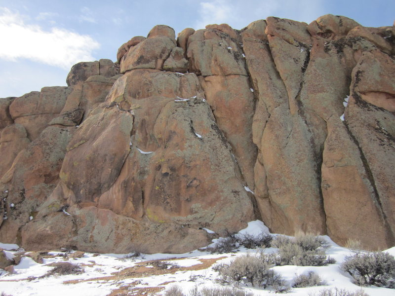 SMAL starts in the R side of the cookie-shaped flake (5.10a), good gear. Then it goes up to bolts (5.10d face). It's on the L side of this photo, and left of BWIAB! the leaning crack in the center that runs from the bottom of the crag to the top.