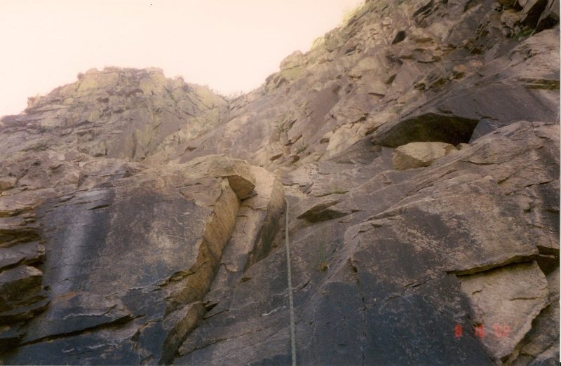 Scanned photo. This is the crux (5.5) of second pitch and the long  20+ foot. run out before and 40+ water worn steep all foot holds (5.2) one
<br>
after it, that's simply a mind trip of don't slip.