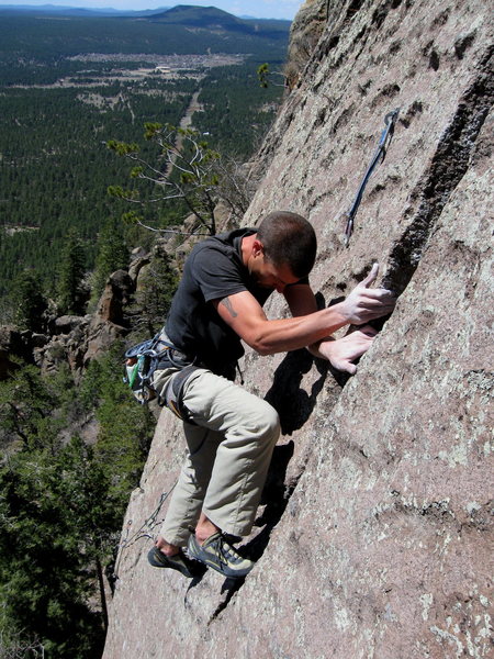 Wade Forrest done with the traverse crux, and closing in on the finish of Lucky Old Sun 5.10+. Great exposure for the backyard.