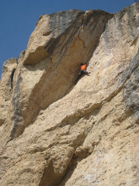 Midway up the corner, nearing the crux.