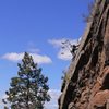 JJ working across the slaberrific crux up high during the FA.
<br>

<br>
Wade Forrest Photo