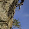 Matt McCormick closing out the crux on Wild Blue Yonder, Rumney, NH