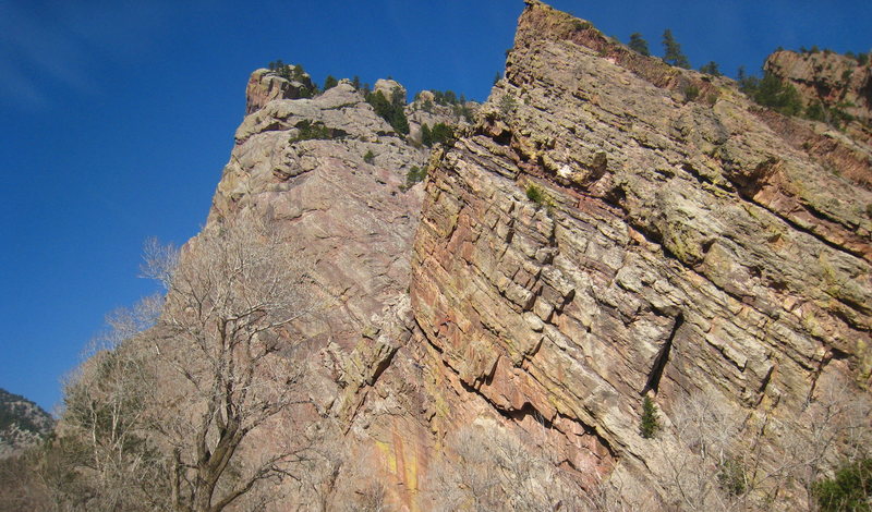 Orange climber 20 feet out from the belay.