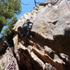 Moving over the roof is the first difficult move.  We chose to TR as there is no gear above the climber's feet.