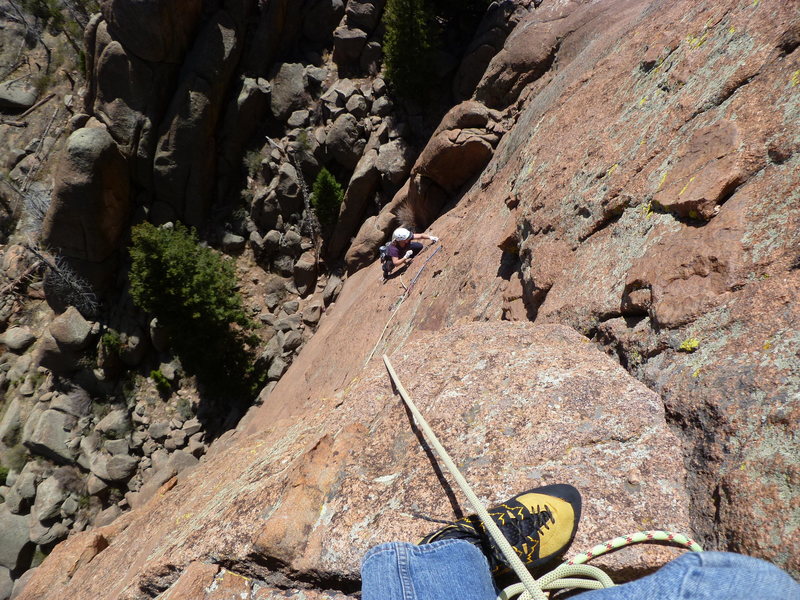 Midway across the traverse on pitch two.