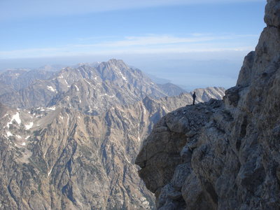 A father and son team wandering off route looking for the OS with Jackson Lake in the back ground.