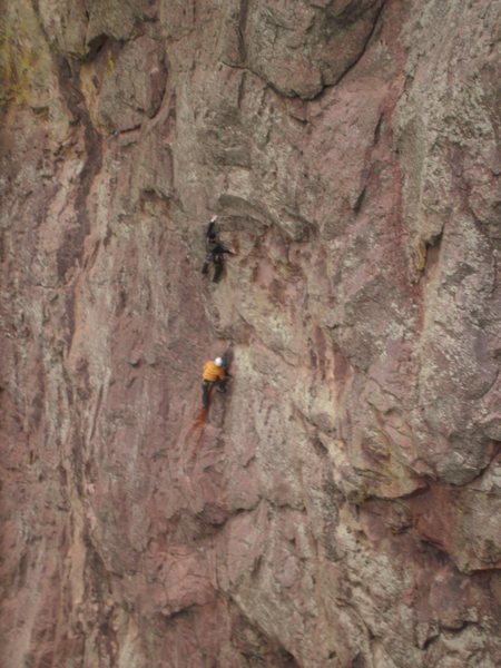 Starting the crux on Sticky Feet.  This guy pulled off a huge block and fell way below the belay...  scary stuff.