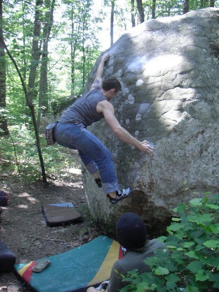 Climb start with left hand on chalked hold above start hold in this photo and moves up to press out. 
