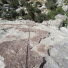 Kristy climbing. Belaying from top of second pitch