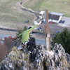 Sebastian clipping the piton at the top of Zehnerstein.