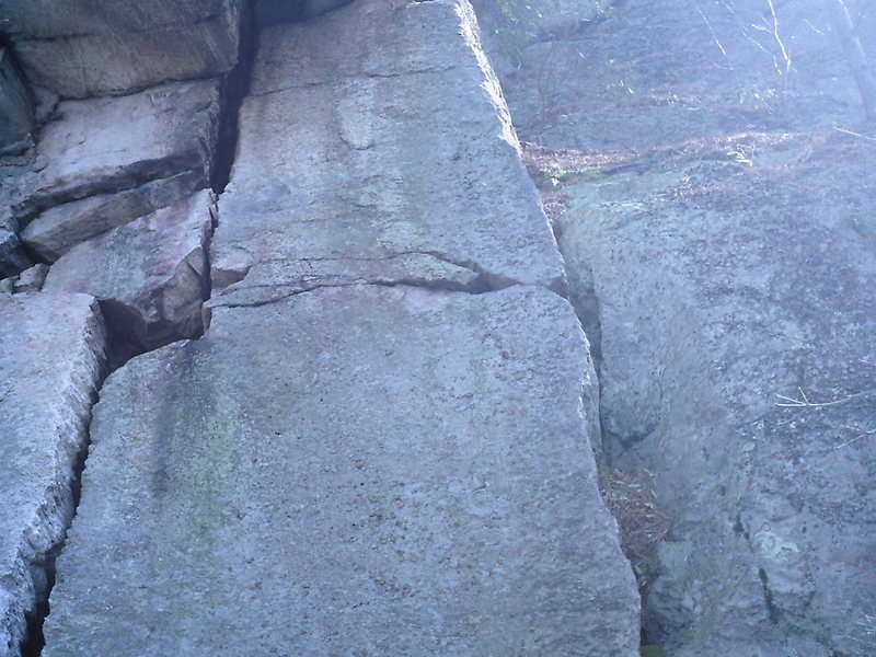 Eves Rib goes up the right side arete (rib), Glens Roof aka Linda Screams to the left in the offwidth.