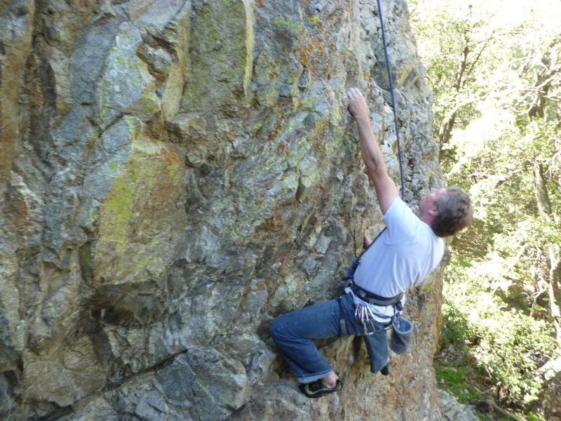 Pulling the moves on the steep wall at the start.