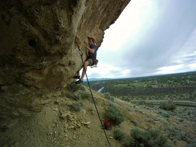 the beginning of the crux, bring your foot to left hand and heel hook, get solid and stand as high as possible, powerful crossover with your left hand, grab the sidepull, reset hands and dyno to huge jug.<br>
<br>
Photo by Brain Mosbaugh<br>
