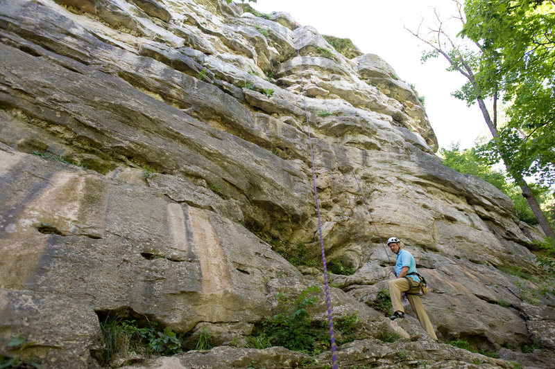 Michael McKay stands below Open Book (5.10) at Capen Park